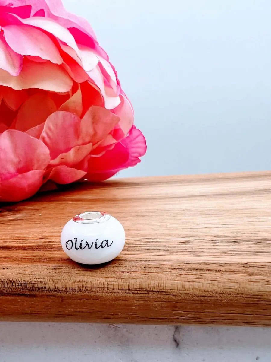Flowers and a pandora style breastmilk bead by Midwife Balance